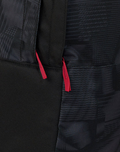 Close-up of a black bag with red drawstrings on a dark background