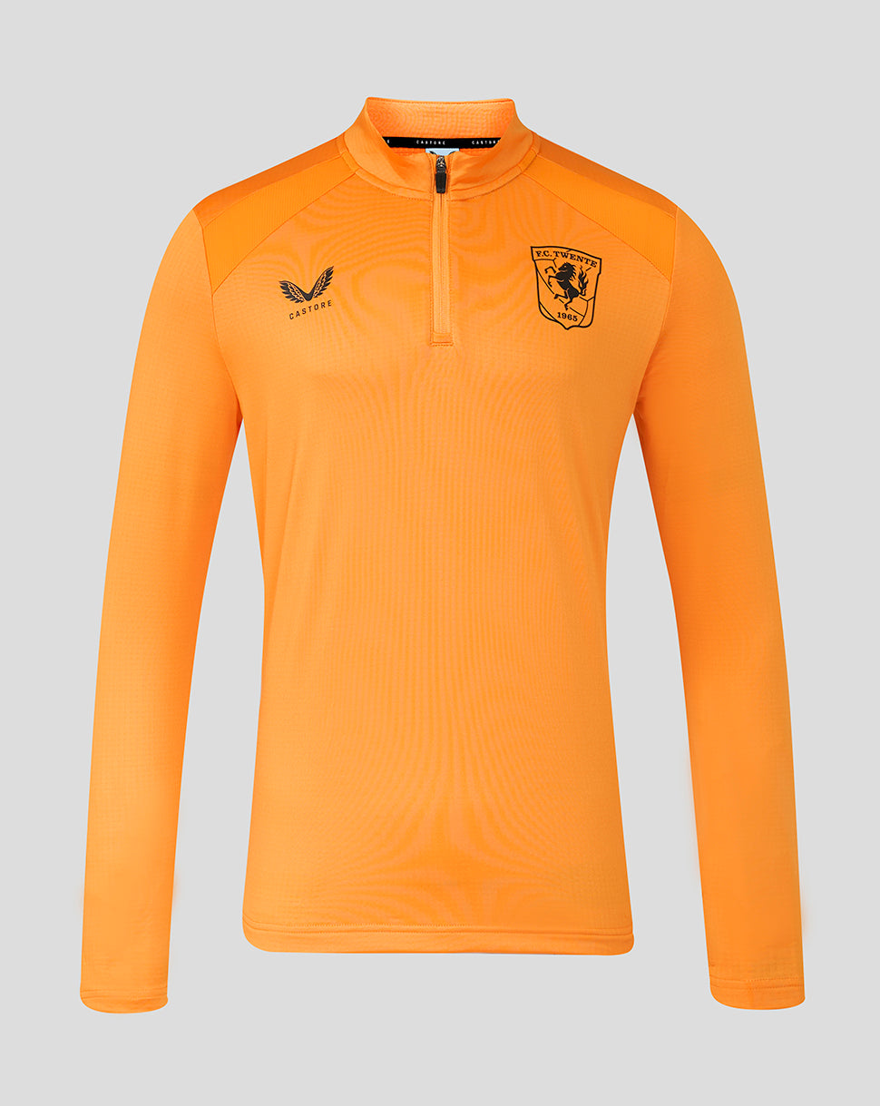 Front view of bright orange FC Twente training midlayer top with crest on chest and Castore logo