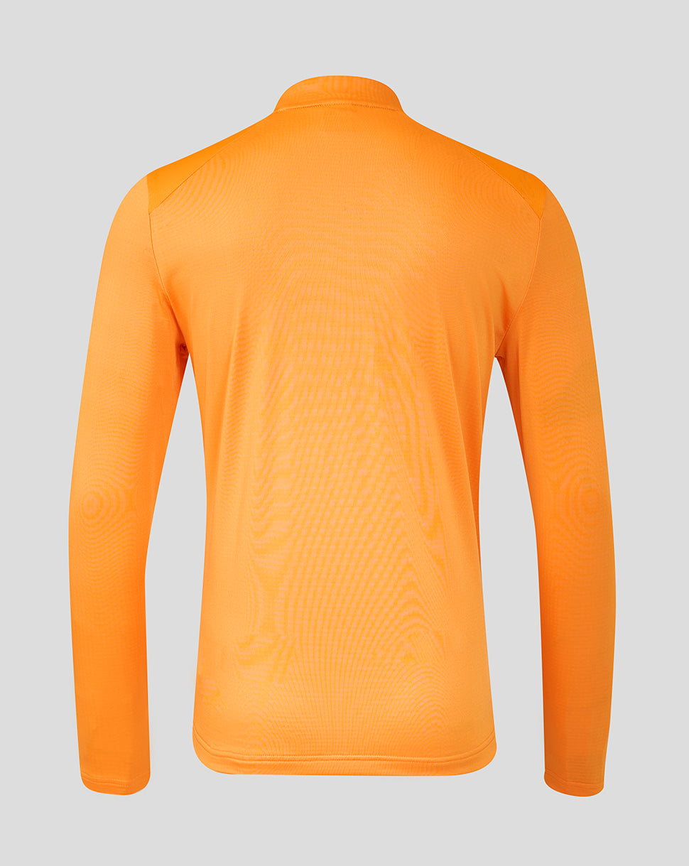 Front view of bright orange FC Twente training midlayer top with crest on chest and half zip collar