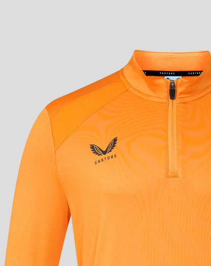 Close up of FC Twente orange training midlayer with chest crest and Castore logo.