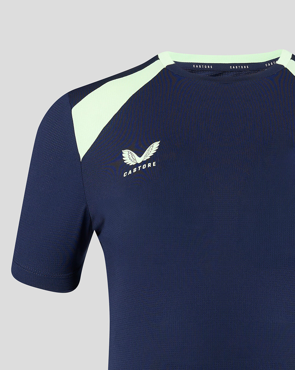 Close-up of navy T shirt neckline showing pale mint shoulder panel and Castore branding near the collar.
