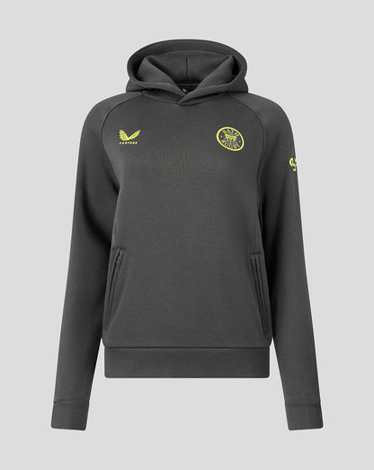 A dark gray pullover hoodie with yellow accents, featuring a yellow Castore logo on the right chest and a circular yellow crest on the left chest, displayed against a solid gray background.