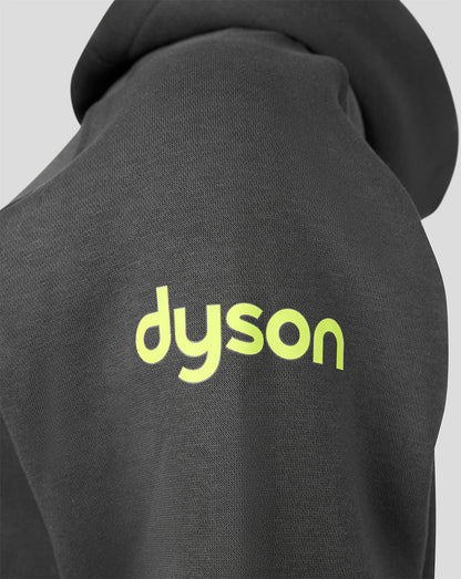 Close-up of a dark gray or black hoodie with a bright neon yellow-green 'dyson' logo printed on the chest, set against a light gray background.