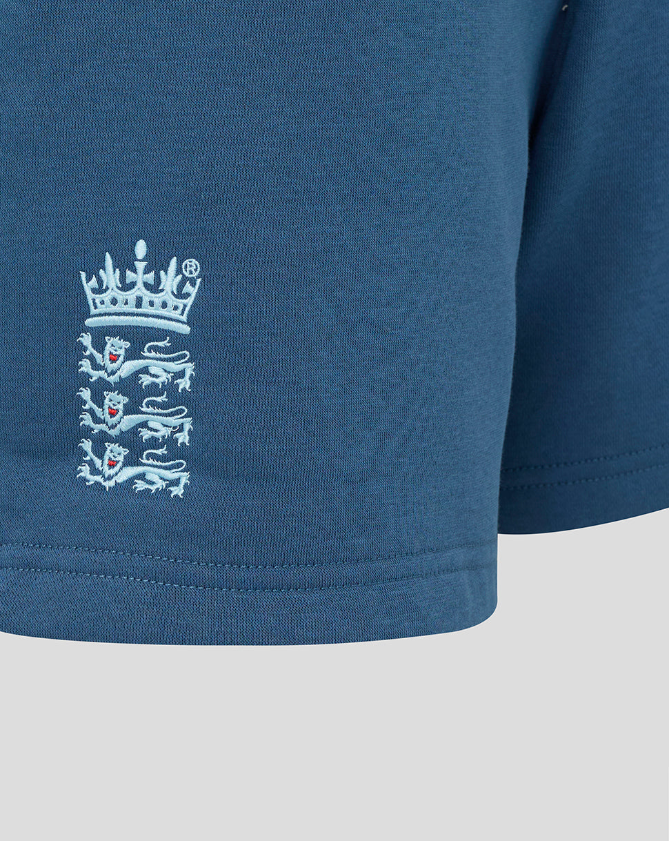 Navy blue shirt with a white embroidered logo on a light gray background