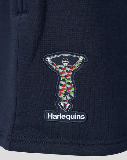 Navy blue fabric with a colorful embroidered design and 'Harlequins' branding.