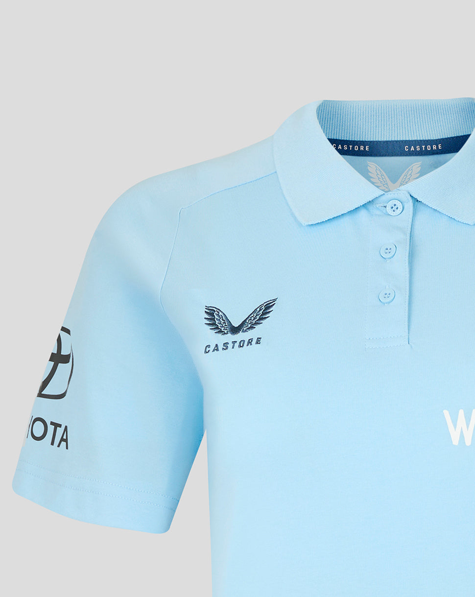 Light blue polo shirt with visible branding on a light gray background