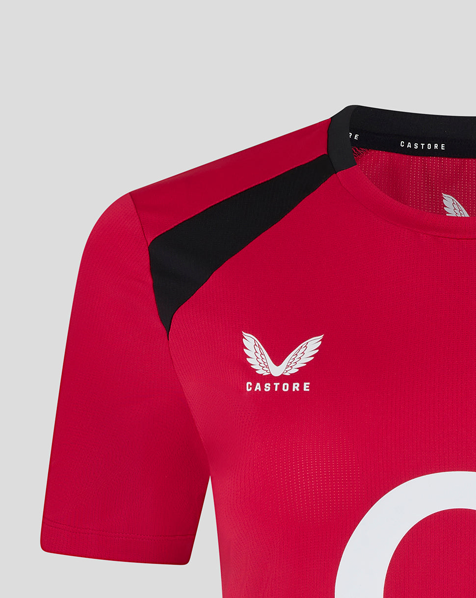 Red sports jersey with black sleeves and 'Castore' logo on a light gray background
