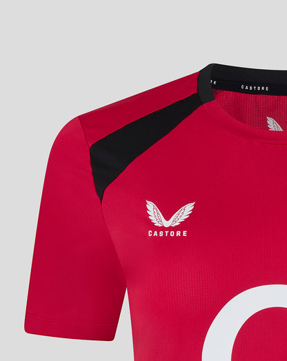 Red sports jersey with black sleeves and 'Castore' logo on a light gray background