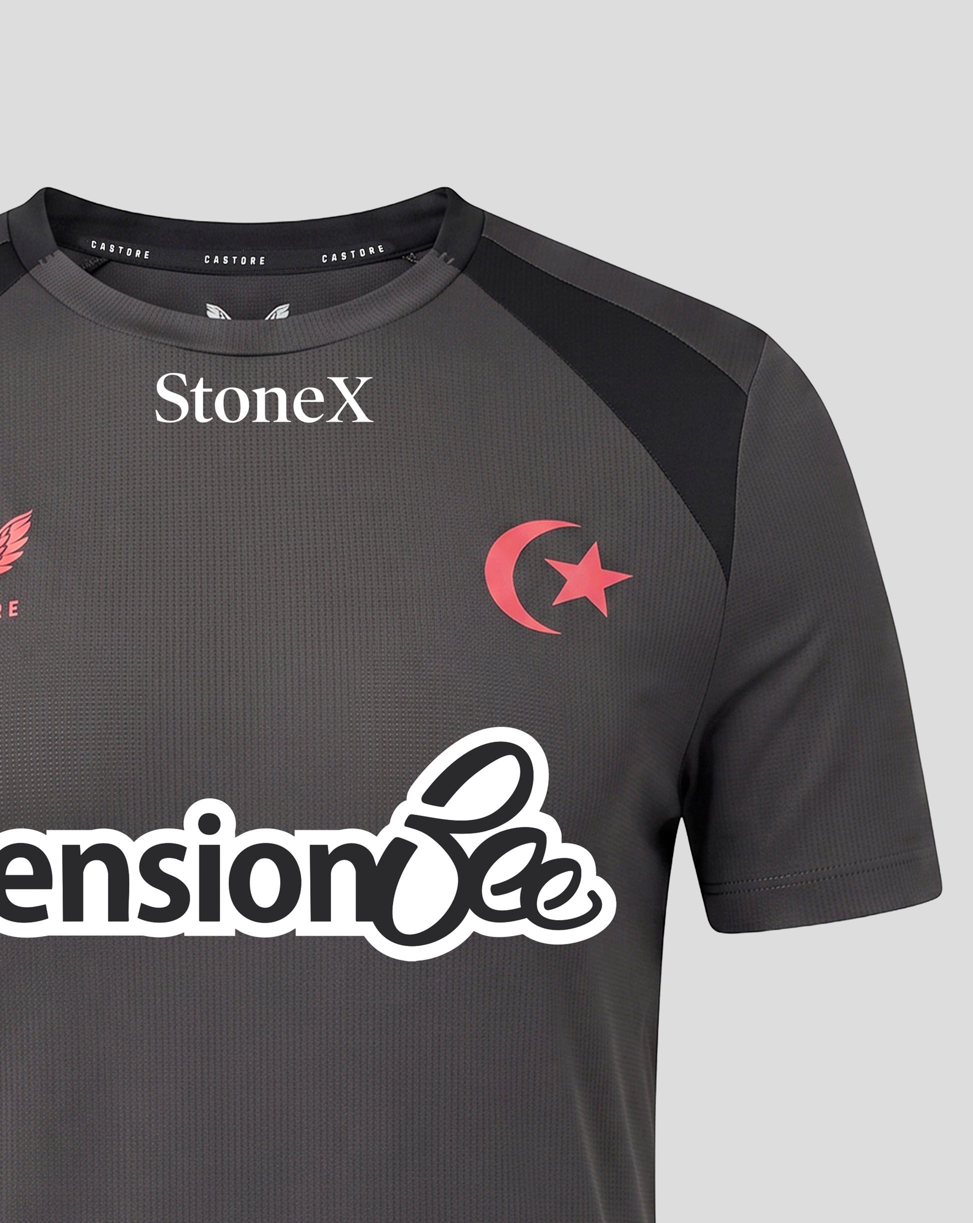 A close-up of a dark gray athletic jersey with black shoulder panels, featuring the white StoneX logo on the chest, a red crescent and star emblem, and a large white 'Pension Bee' sponsor logo across the front.