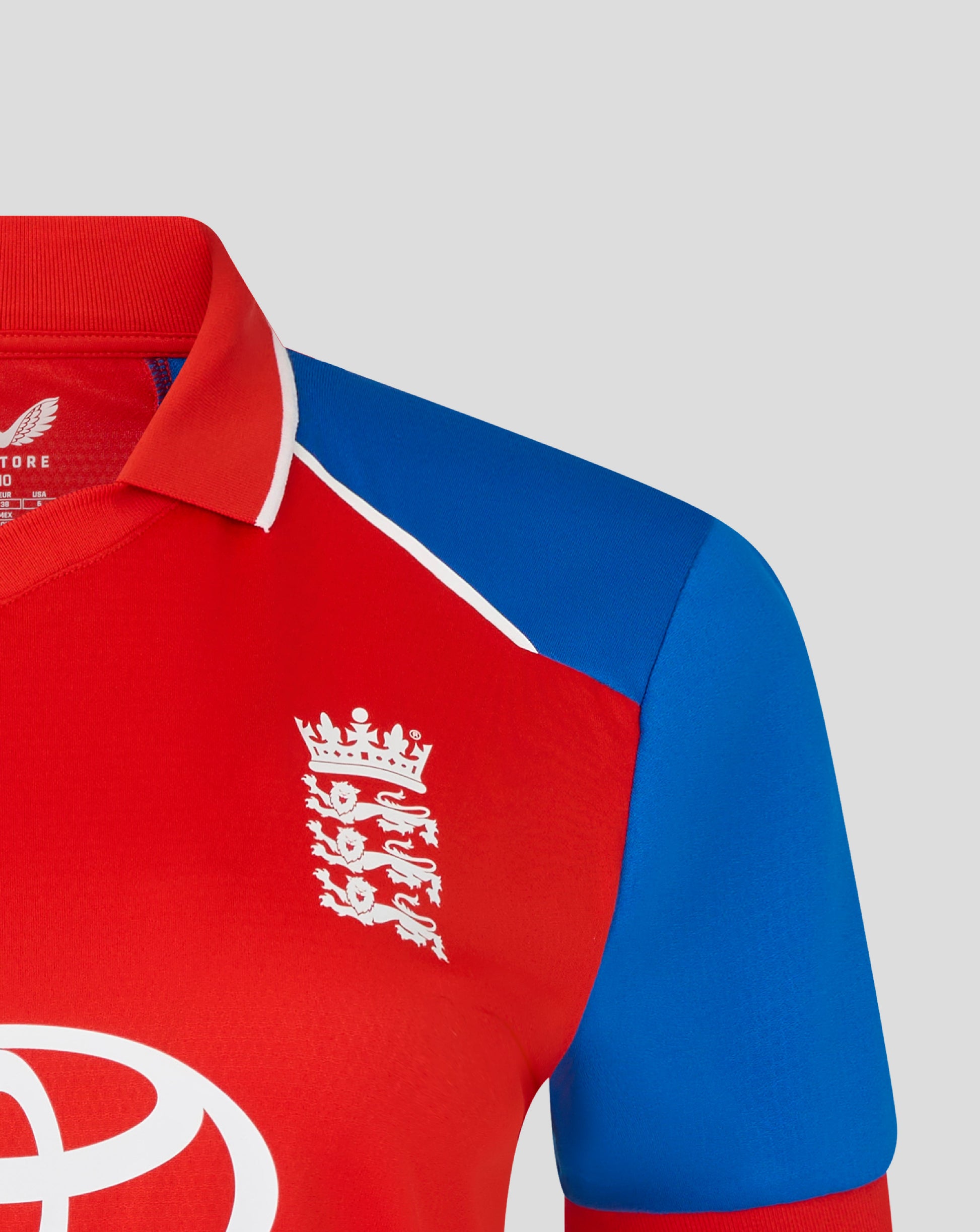 Red and blue sports jersey with a logo on a gray background