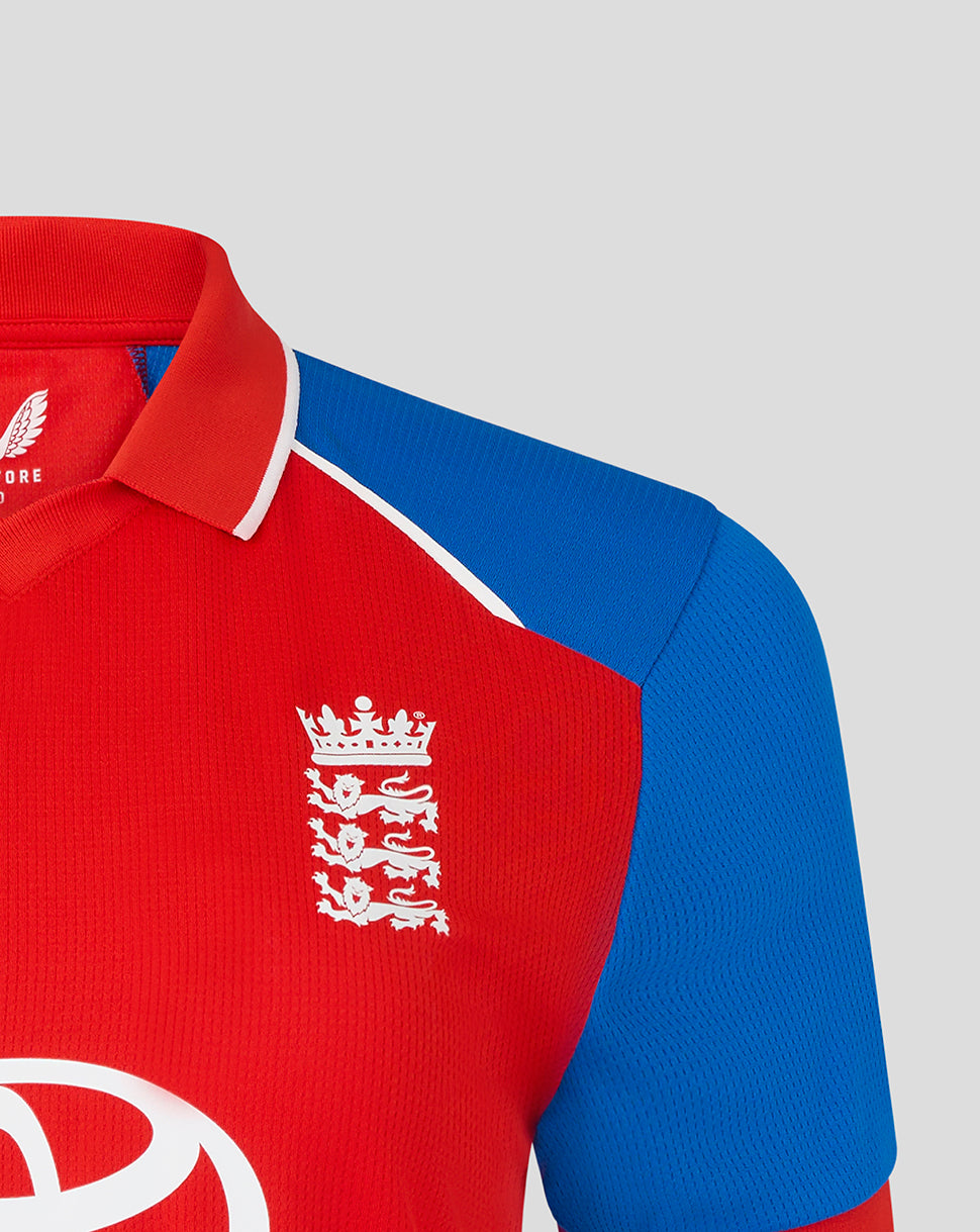 Red and blue sports jersey with a prominent logo on a light gray background