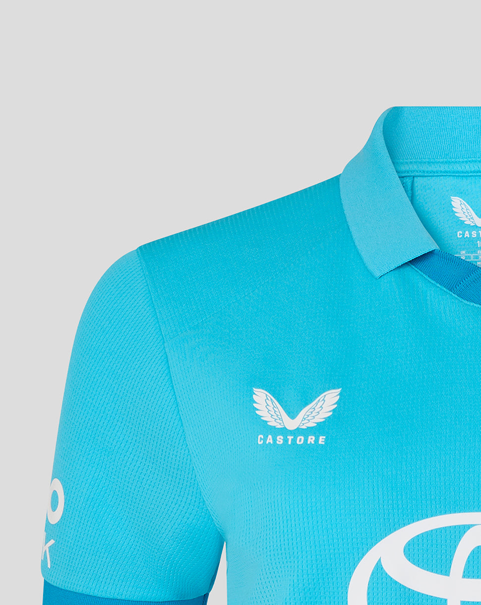Blue cycling jersey with Castore logo on a gray background