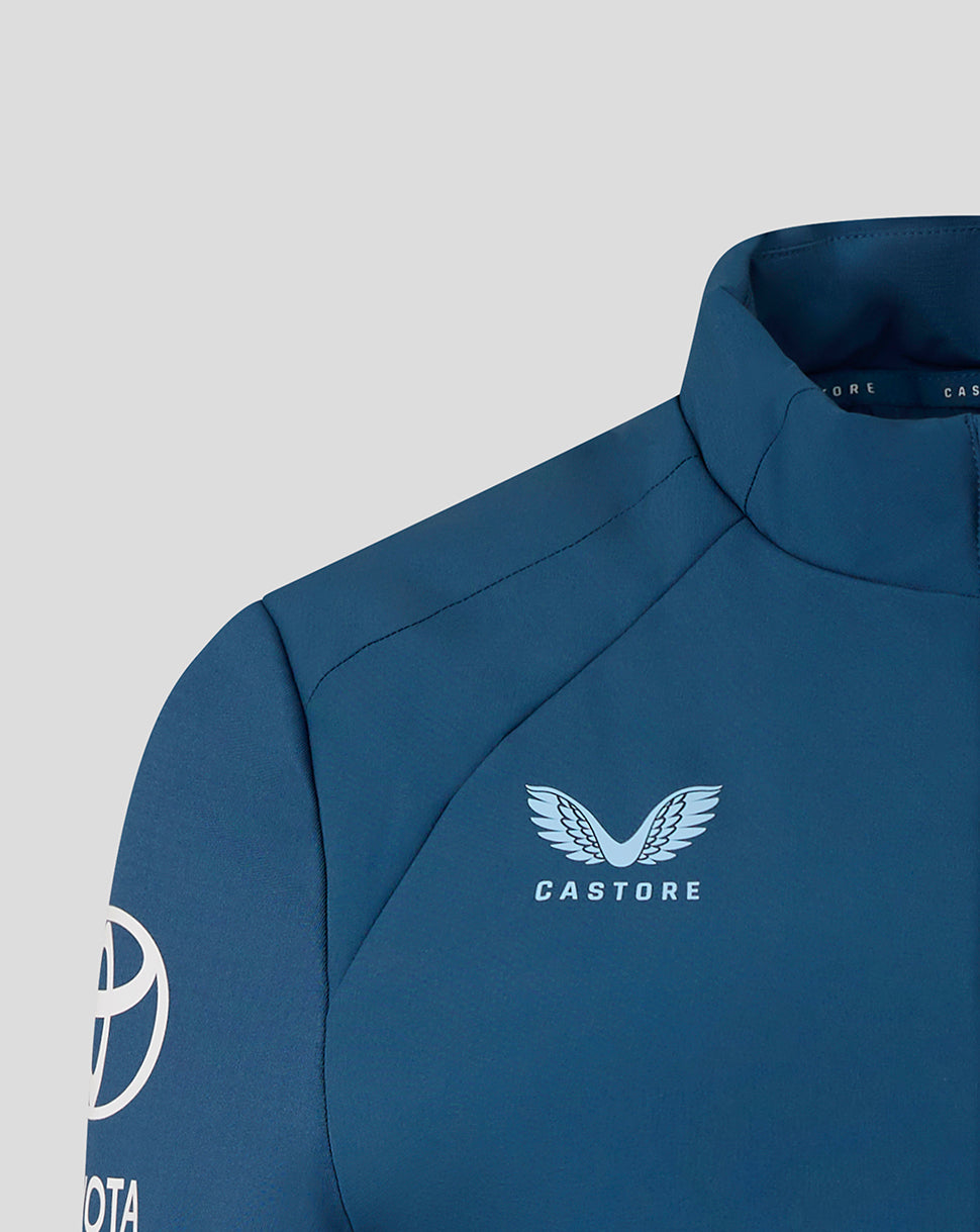 Blue jacket with Castore logo on a gray background
