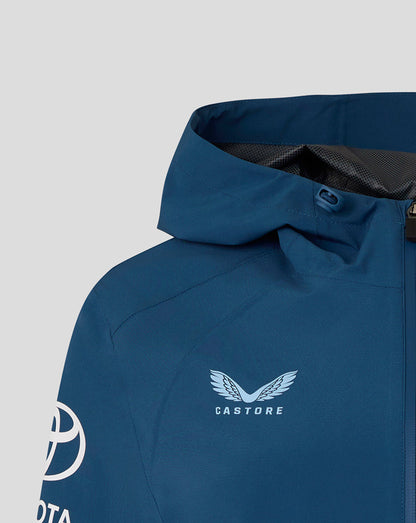 Blue jacket with Castore logo on a gray background