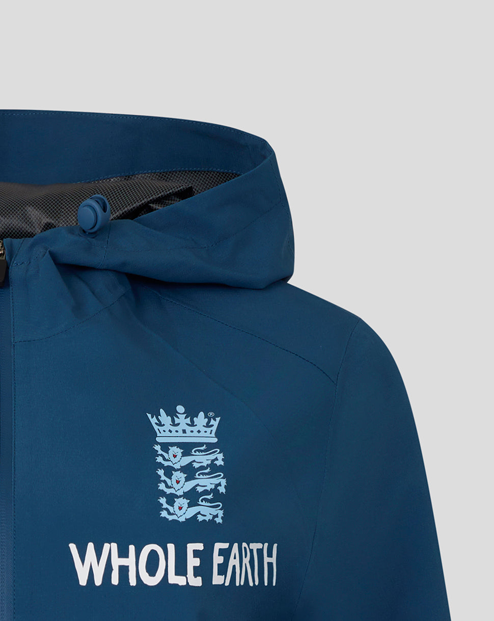 Blue jacket with 'Whole Earth' logo on a gray background