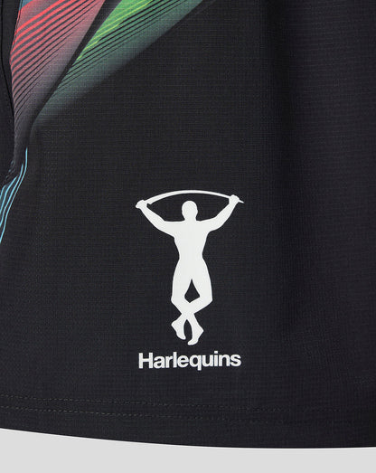 Close-up of a black athletic jersey with a white Harlequins logo featuring a leaping figure and the brand name 'Harlequins' printed below it.