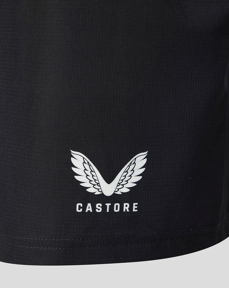 Close-up of a black athletic garment featuring a white Castore wing logo and brand name printed on the front.