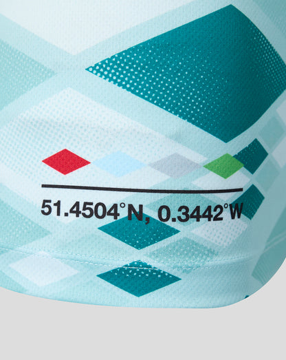 Close-up of a sports jersey with geometric patterns and coordinates printed on it.