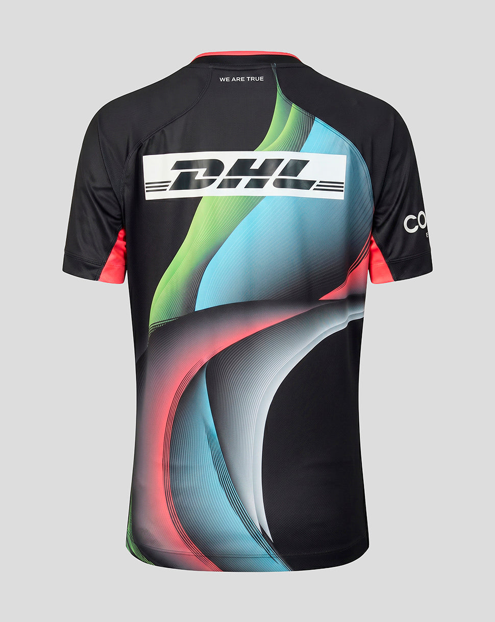 A short-sleeve athletic jersey shown from the back, featuring a black base with a large white DHL logo across the upper back and abstract curved graphic lines in green, blue, pink, and gray. The jersey is photographed on a neutral light gray background.