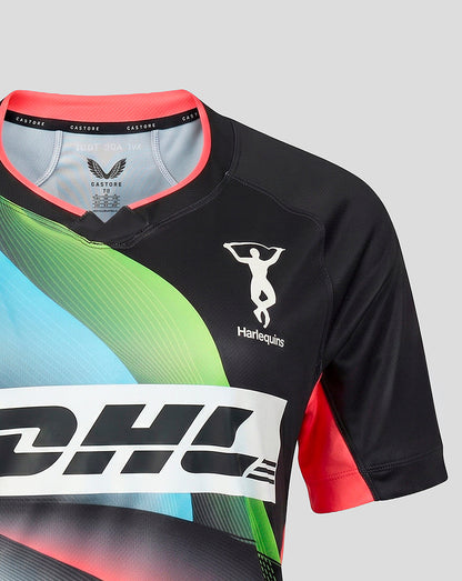 A close-up of a short-sleeve rugby jersey by Harlequins, featuring a black base with a vibrant diagonal wave pattern in green, blue, and pink, and a white DHL sponsor logo across the chest.