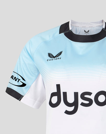 A close-up of a light blue and white Castore rugby jersey with black trim, featuring the 'dyso' sponsor logo on the front and a 'Giant' sleeve logo, set against a neutral gray background.