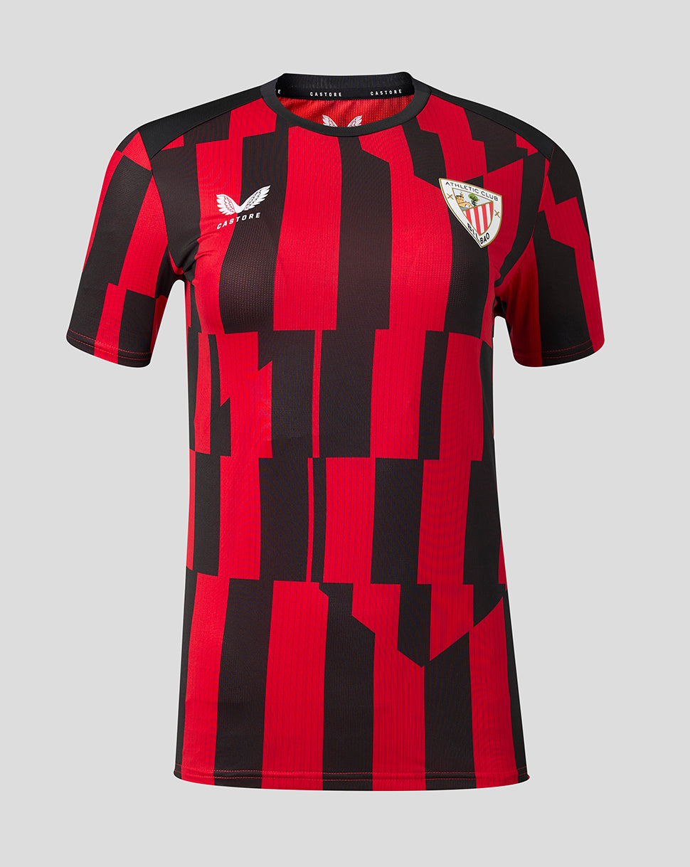 Front view of Athletic Club matchday shirt with red and black geometric blocks, Castore logo on left chest and crest on right.