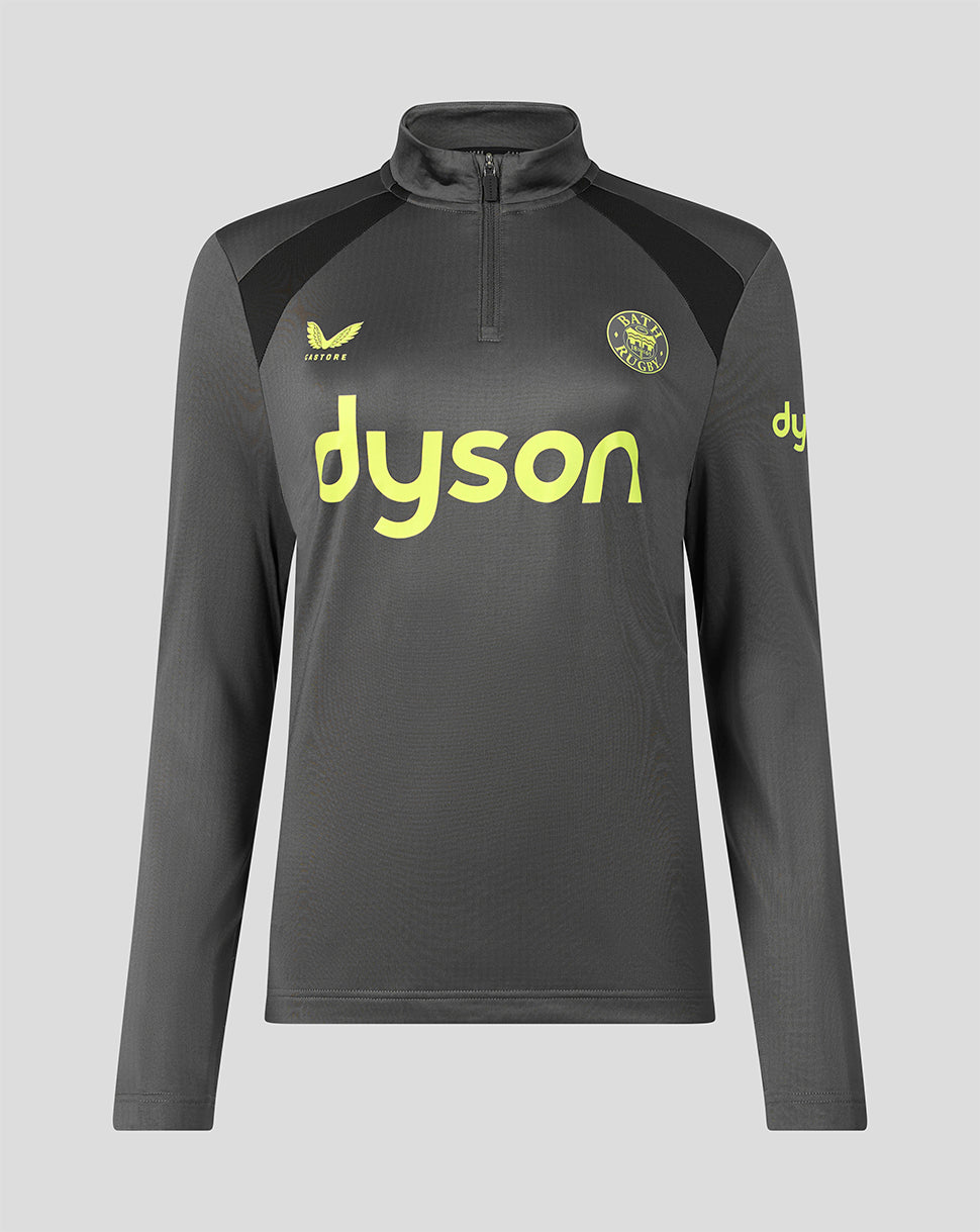 A dark gray long-sleeve athletic quarter-zip pullover with a high collar, featuring a bright yellow Dyson logo on the chest, a yellow castore brand logo on the right chest, and a yellow club crest on the left chest, shown against a solid light gray background.