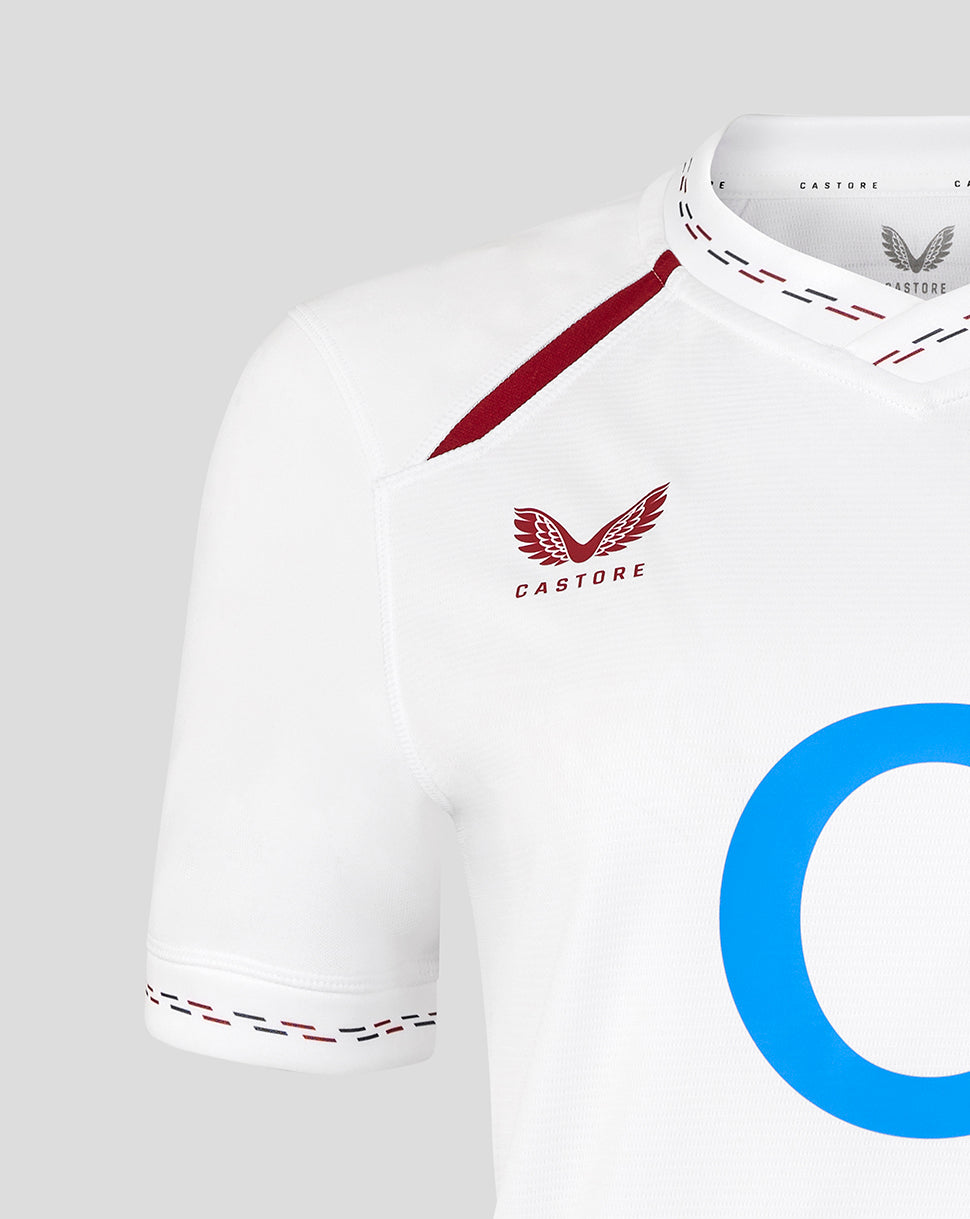 White sports jersey with red accents and a blue logo on a light gray background