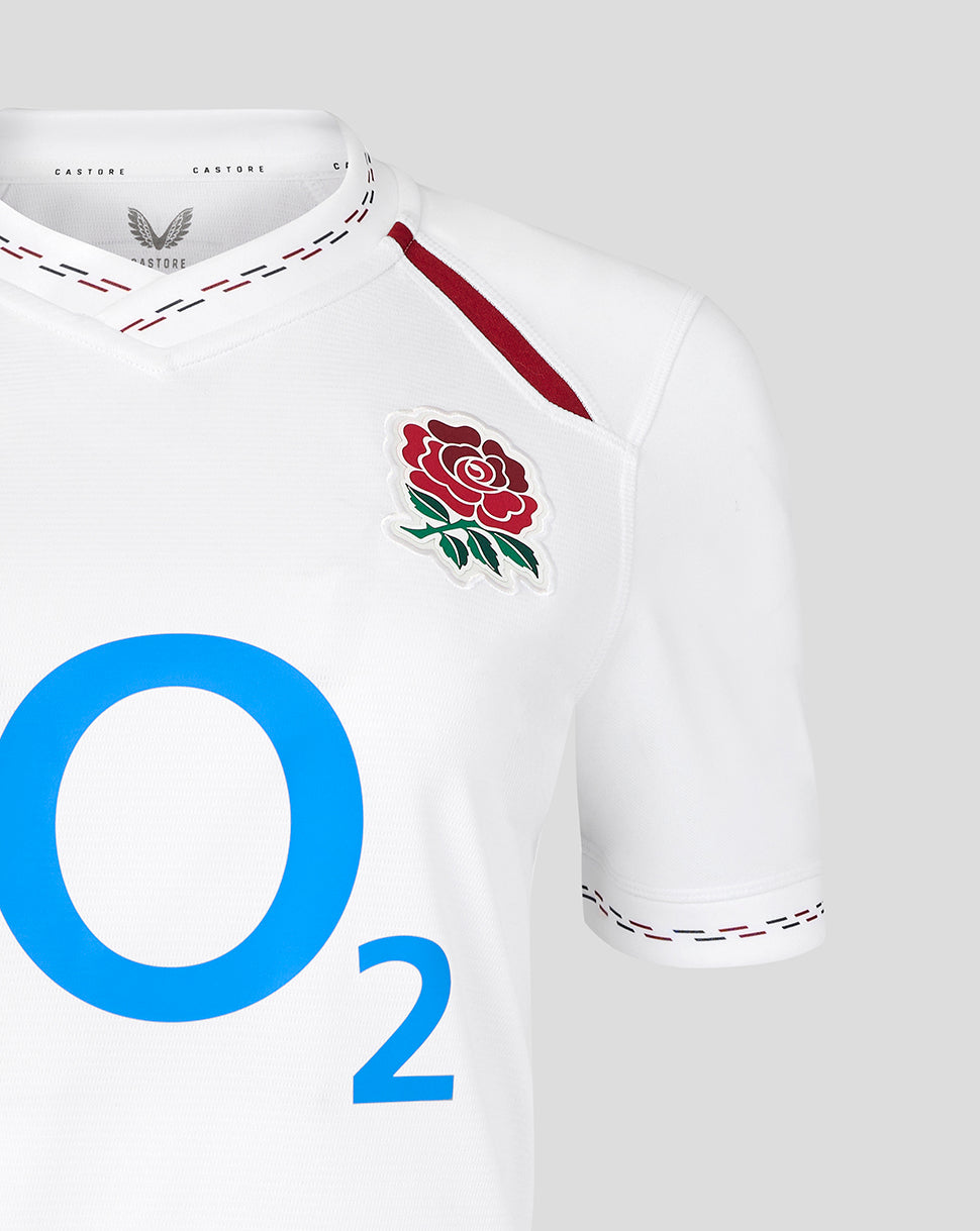 White sports jersey with red rose emblem and 'O2' logo on a gray background