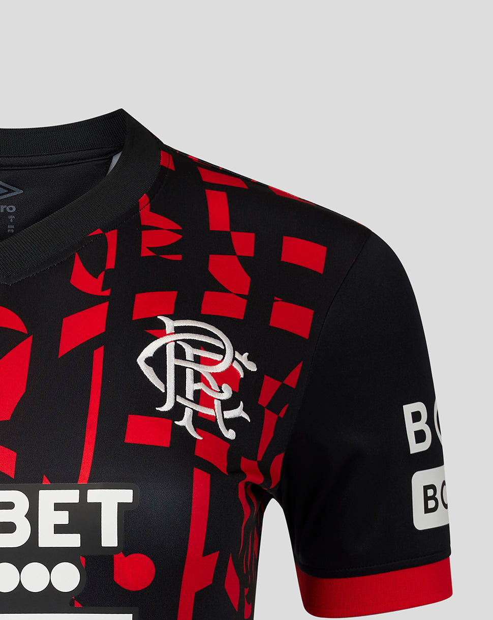 Close-up of a black and red football top with a red geometric pattern, featuring the white Rangers crest on the chest and sponsor logos on the sleeves and front.
