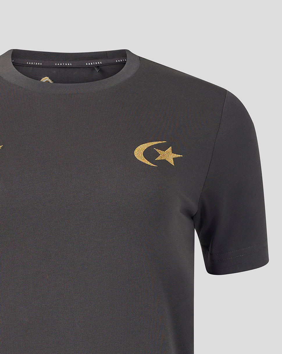A close-up of a dark gray crewneck t-shirt featuring a gold embroidered crescent and star logo on the left chest, set against a solid light gray background.