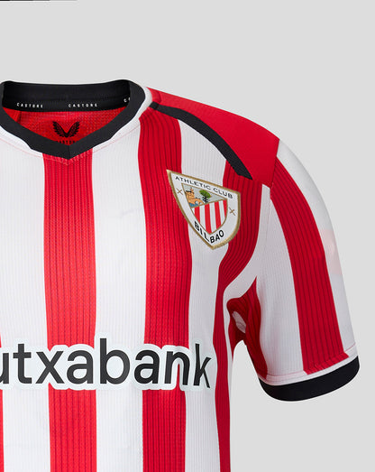 Athletic Club Bilbao home shirt close up showing red and white vertical stripes and the club crest on the chest.