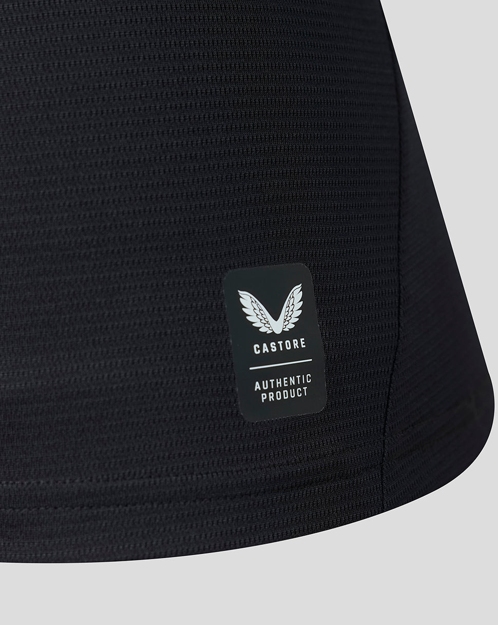 Close-up of black textured Athletic Club Away Shirt fabric with Castore authentic product badge