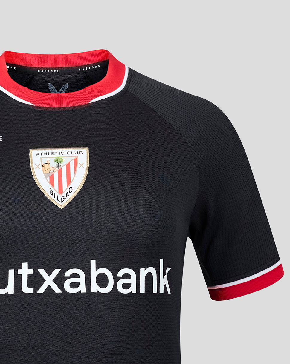 Close up of black away jersey fabric with AERTEK branding on the chest area