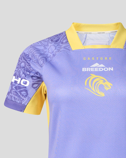 A close-up of a light purple and yellow sports jersey with 'BREEDON' and a lion logo on the chest, and 'CASTURE' on the collar label.