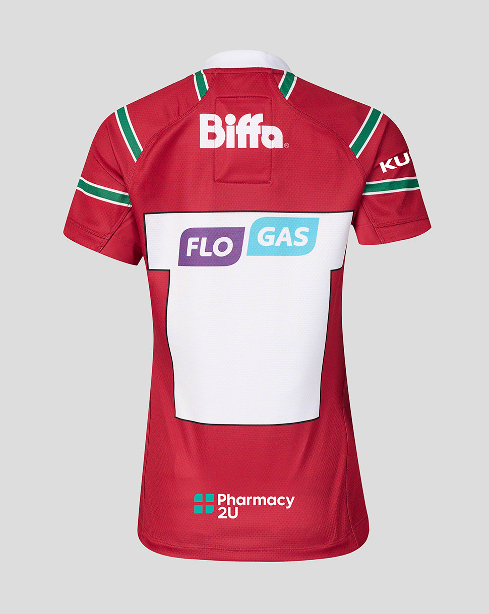 The back of a red short-sleeve sports jersey with green and white shoulder stripes, featuring sponsor logos including Biffa, FLO GAS, and Pharmacy 2U on a light gray background.