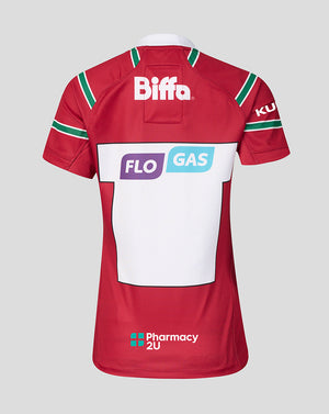 The back of a red short-sleeve sports jersey with green and white shoulder stripes, featuring sponsor logos including Biffa, FLO GAS, and Pharmacy 2U on a light gray background.