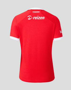 Rear view of FC Twente home shirt in red with white neck trim, featuring Tukkers at the collar and D-reizen logo on the upper back.