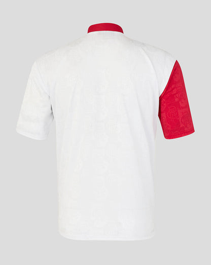 White polo shirt with red accents on a light gray background