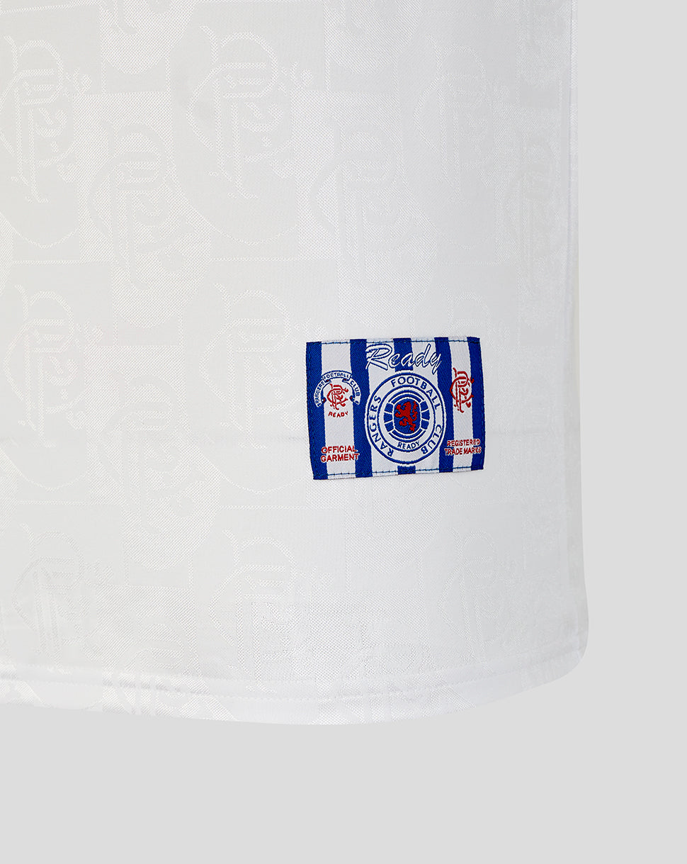 Close-up of a white hoodie with a striped patch featuring a logo and text.