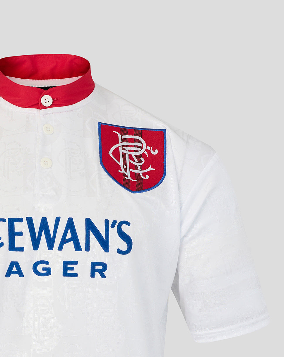 White polo shirt with red collar and 'McEwan's Lager' branding on a light gray background
