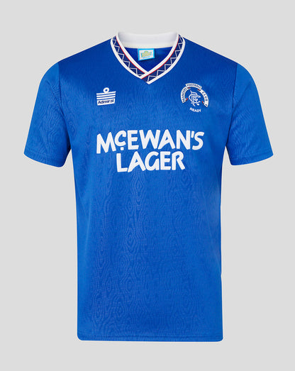 Blue sports jersey with 'McEwan's Lager' branding on a gray background