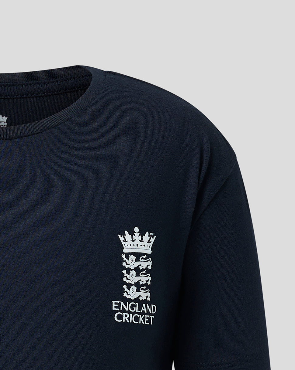 Close-up of a dark navy long-sleeve shirt with a white England Cricket crest and text printed on the left chest, shown against a light gray background.