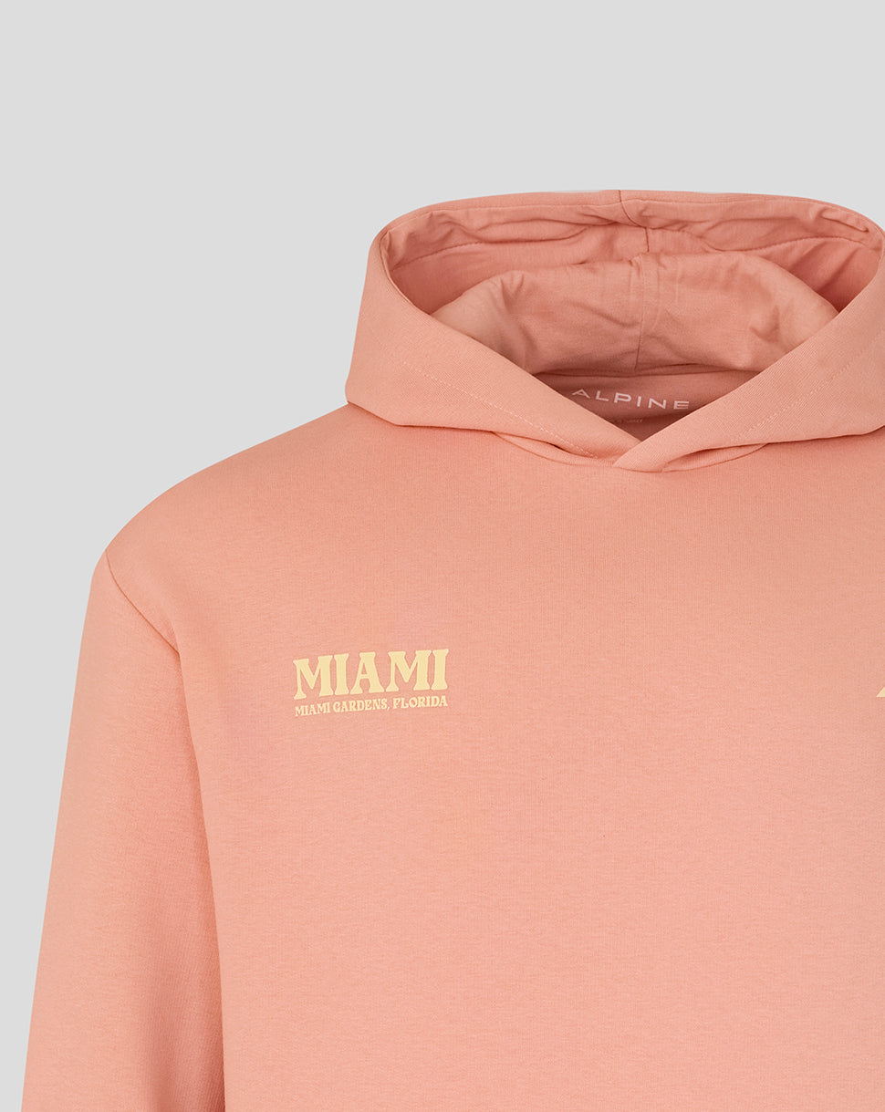 Peach hoodie with Miami chest print and Alpine branding at the neck