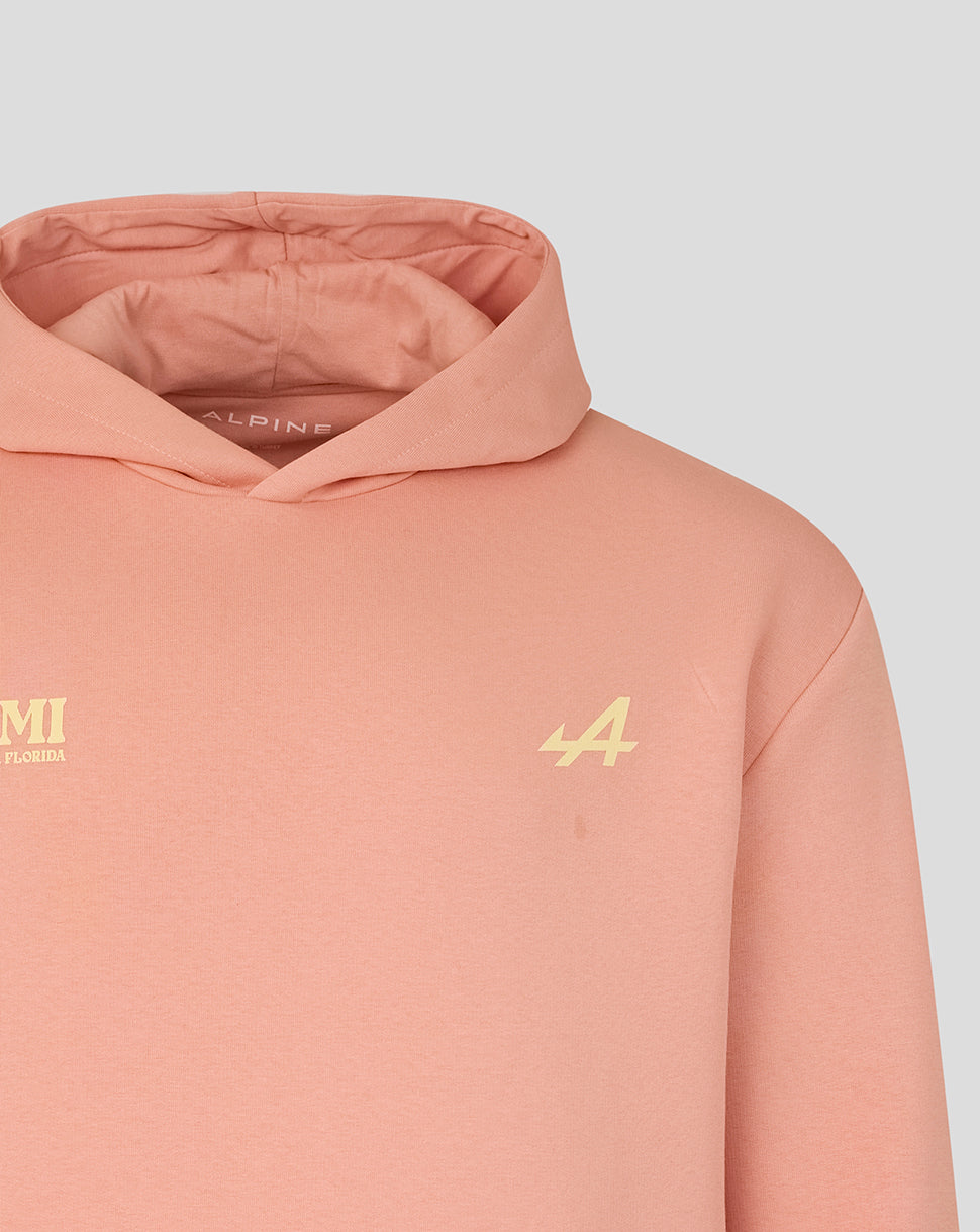 Peach hoodie with pale yellow 44 on right chest and Alpine A logo on left chest