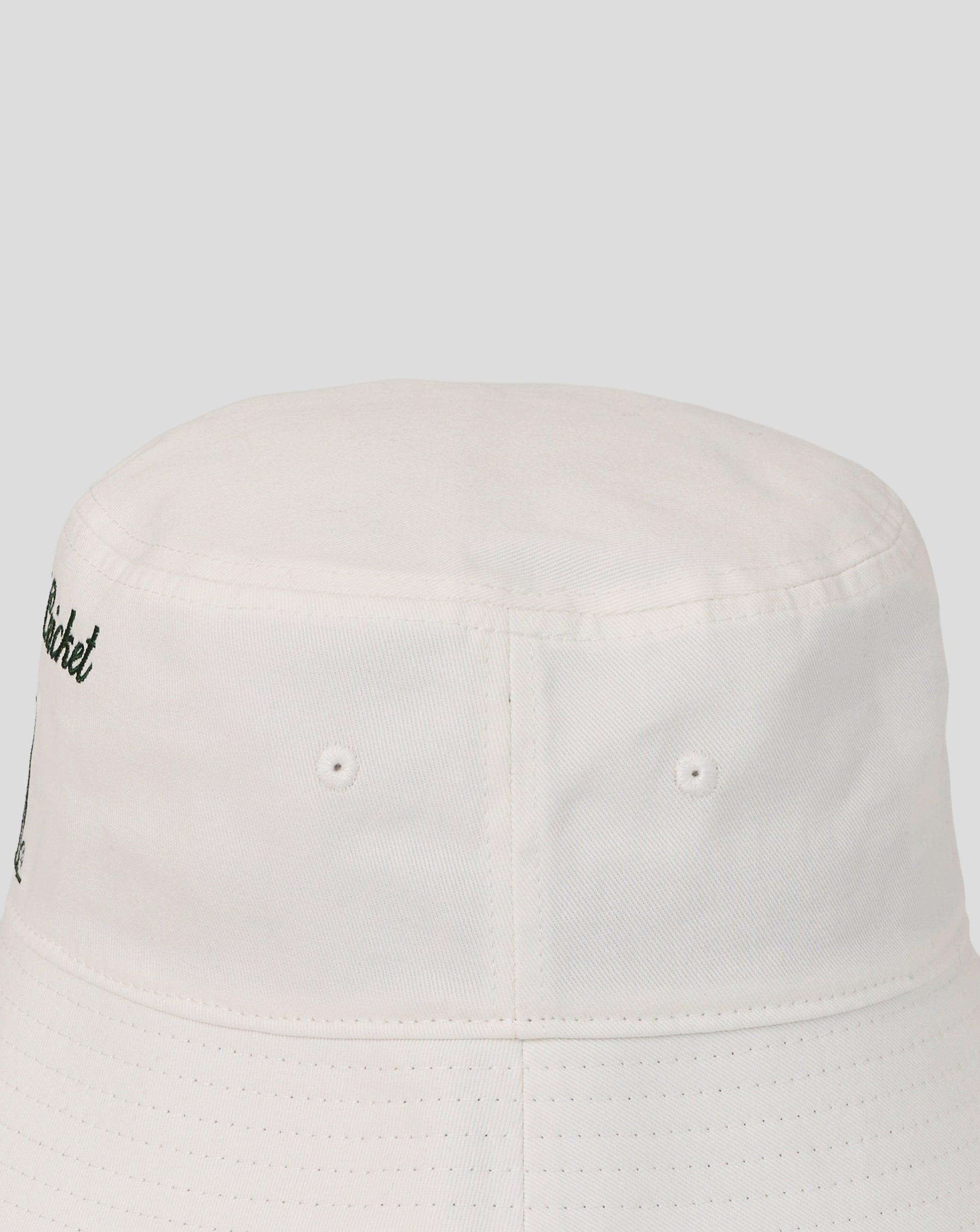 White bucket hat with a small logo on a white background
