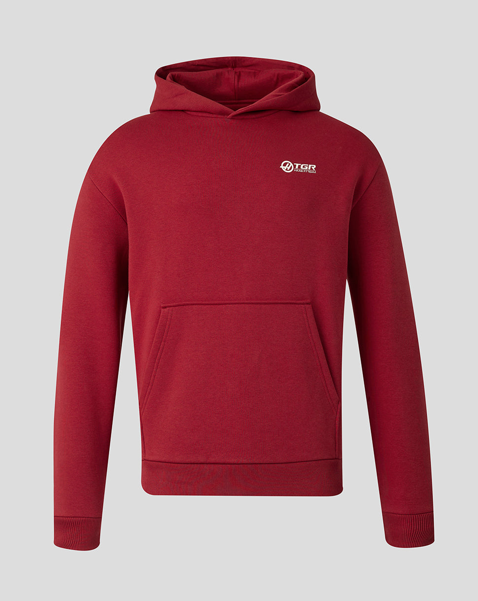 A dark red pullover hoodie with a small white and black 'HAAS' logo on the left chest, displayed on a neutral light gray background.