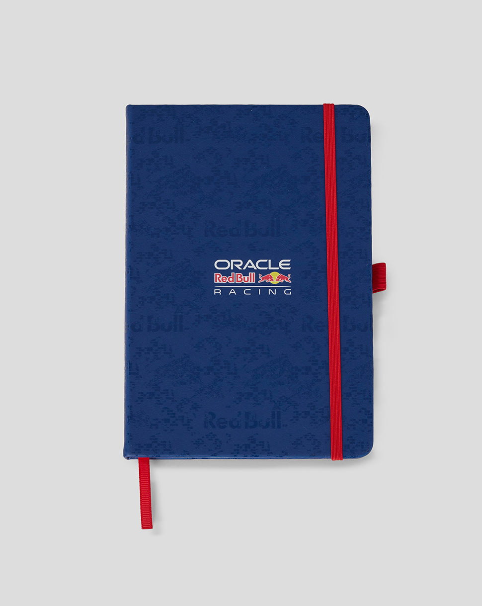 Blue notebook with red accents and Oracle Red Bull Racing logo on a light gray background