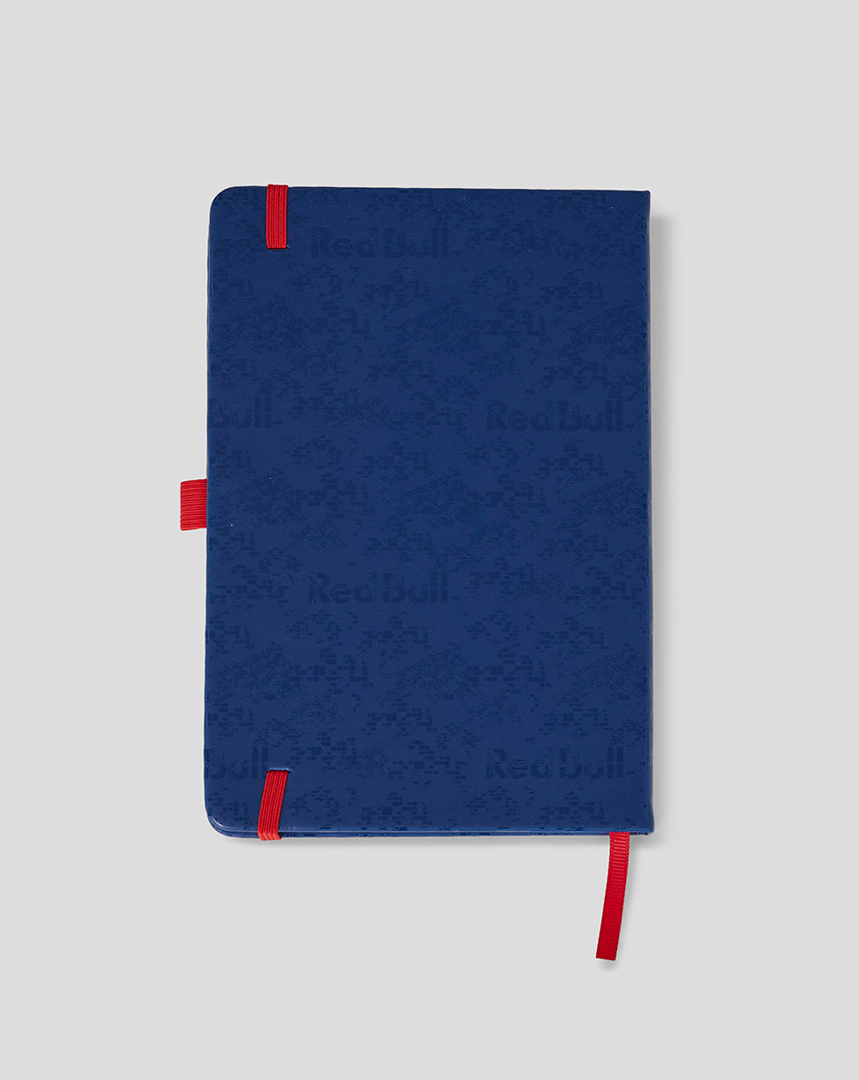 Blue notebook with red accents on a light gray background