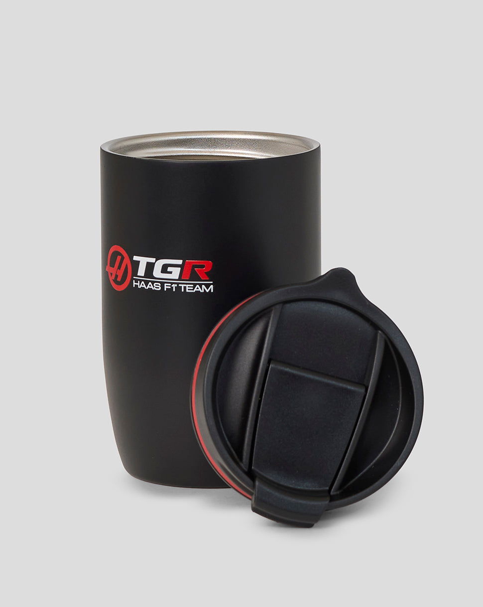 Black insulated tumbler with TGR Haas F1 Team logo on a gray background